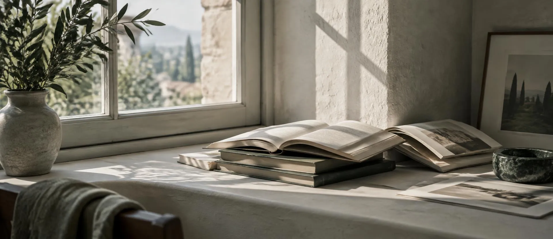 Open books on a sunlit windowsill in a quiet room